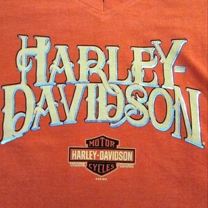 Harley Davidson orange women top. Size S.